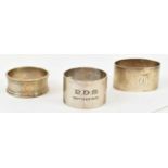 A group of three hallmarked silver napkin rings, approx 3.4ozt/106g.