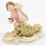 MEISSEN; a porcelain figure of a cherub gathering fish from a basket, height 9.5cm (af).Condition