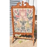 A large 19th century walnut and fret carved fire screen with inset tapestry panel, width 80.5cm,