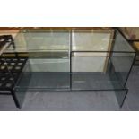 A modern glass coffee table, width 130cm, and two further side tables (3).