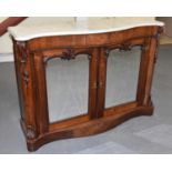 A 19th century rosewood serpentine front credenza with white marble top above pair of mirrored