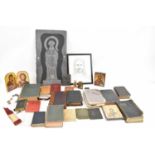 A collection of religious items including bibles, Pilgrim's Process, etc.