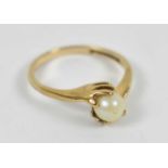 A 9ct yellow gold ring set with central pearl, size O, approx 2.4g.