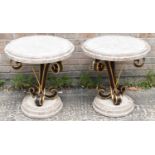 A pair of contemporary sectional circular marble topped occasional tables raised on scroll metal
