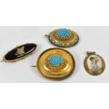 Two yellow metal brooches set with turquoise stones, another yellow metal brooch, and a yellow metal