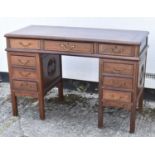 A Chinese hardwood nine drawer pedestal desk, width 124cm.