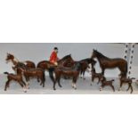 BESWICK; a group of ten horses including jockey on horseback.