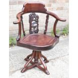 A Chinese hardwood evolving elbow chair with marble inset to the back