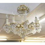 A group of four modern brass and cut glass chandeliers, height approx 55cm.