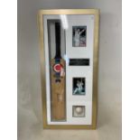 SHANE WARNE; a box framed cricket bat and ball, both signed by the legendary Australian cricketer,
