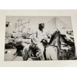 Muhammad Ali; a black and white photograph of the legendary boxer riding a horse, bearing his