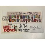 JAMES BOND; an Ian Fleming first day cover bearing the signatures of George Lazenby, Dame Diana