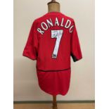 CRISTIANO RONALDO; a replica Manchester United 2003 debut season home shirt, signed by the