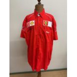 MICHAEL SCHUMACHER; an official Ferrari Fila short sleeve shirt, signed to the front.