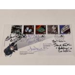 JAMES BOND; a first day cover bearing the signatures of Dame Judi Dench, Dame Diana Rigg, Shirley