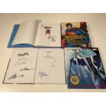 DC COMICS; two books, Superman in hard sleeve complete with two prints and signed by Brandon