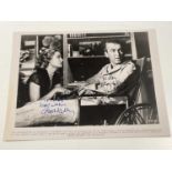 JAMES STEWART AND GRACE KELLY; a black and white photograph from the film 'Rear Window' stamped