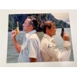 JAMES BOND; a large promotional colour photograph bearing signature of Roger Moore and Christopher