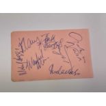 CROSBY, STILLS AND NASH; a page from an autograph book bearing their signatures along with several