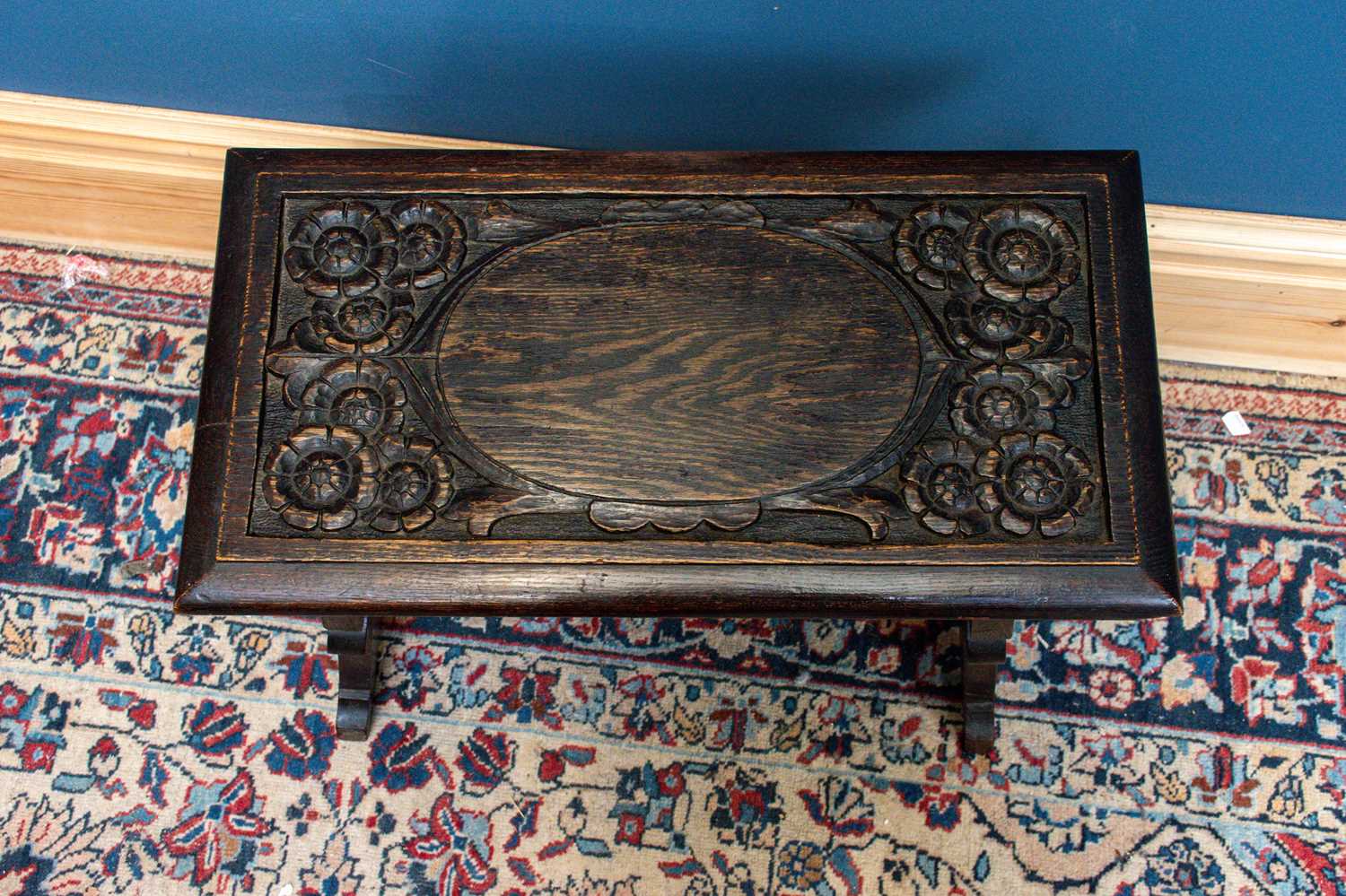 An early 20th century carved oak trestle style coffee table, length 55cm depth 29cm, height 49cm. - Image 2 of 2