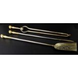 A 19th century three piece companion set with brass finials and steel columns, length of poker