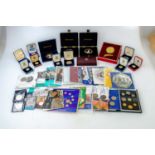 A collection of British commemorative coins including three Golden Jubille crowns, four folders