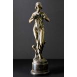 A reproduction bronze figure of an Art Nouveau style maiden with a band to her hair and a floral