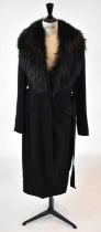 ELIE SAAB; a black wool mix full length coat with fox fur collar, size 36.