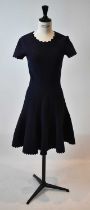 ALAIA; a navy blue wool mix short sleeve flared dress, size 36.