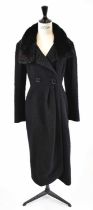 CHRISTIAN DIOR; a black wool mix full length coat with mink collar, size 8.