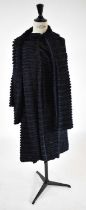 A navy blue and black striped fur and silk long length coat with detachable scarf, size small.