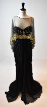 ZUHAIR MURAD; a black 100% silk full length strapless evening dress with gold beaded lace cape, size