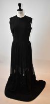 ELIE SAAB; a black wool and silk full length evening dress embellished with sequins, size 40.