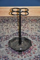 An early 20th century cast iron four division stick stand, height 64cm.