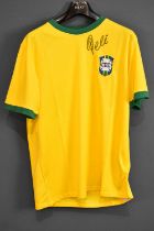 PELÉ (EDSON ARANTES DU NASCIMENTO); a 1970s Brazil retro-style football shirt, signed to the