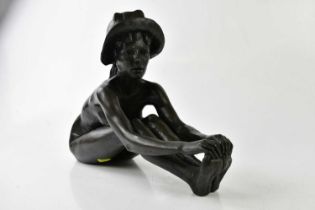 † TOM GREENSHIELDS (1912-1994); a cast bronzed figure of a seated girl wearing a hat, height 30cm,