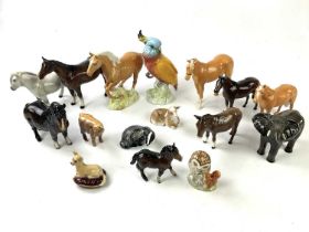 BESWICK; a collection of animal figures to include three palomino horses, four horses, a donkey, a