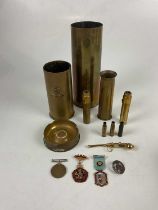 A collection of assorted militaria to include WWII Defence Medal, various trench art pieces,