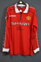 SIR ALEX FERGUSON; a Manchester United Treble Winners retro-style football shirt, signed and