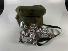 Two 20th century army respirators, in green Kevlar bag.