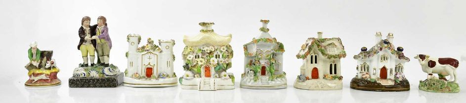A small collection of ceramic cottages, height of largest 13cm, together with three ceramic figure.