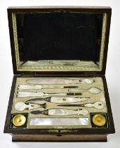 A 19th century burr oak stationery case, the cover with applied mother of pearl panel engraved