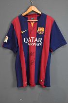 BARCELONA; a 2014/15 football shirt, signed to the front by Messi, Suarez and Neymar, size XL.