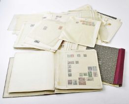 A large collection of stamps contained in three albums and loose, New Zealand, Canada, Tasmania
