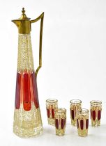 A 19th century Bohemian six piece drinking set, comprising tapering ewer with gilt metal collar