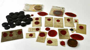 A collection of 19th century rosewood/ebony and cardboard wax seal holders and a large collection of