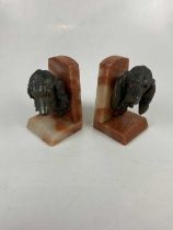 A pair of Art Deco spelter and alabaster bookends modelled with hounds' heads, height 19cm (2).