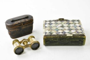 A cased pair of mother of pearl and brass opera glasses, with a mother of pearl photograph album (