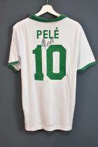 PELÉ (EDSON ARANTES DU NASCIMENTO); a New York Cosmos retro-style football shirt, signed to the