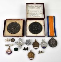 A WWI medal awarded to L-11870 Pte J.A. Helliwell, Ni-LRS, two Lusitania propaganda medals, and a